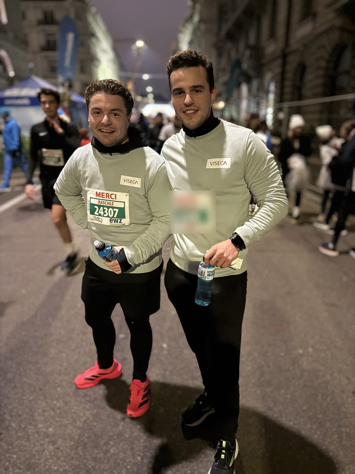 Florian Raschle and a friend after the Christmas race, both in Viseca tops with race numbers